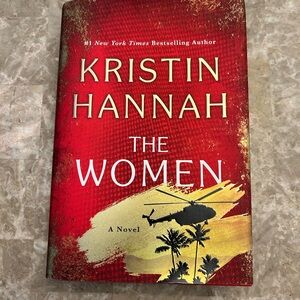Red Hardcover Novel 'The Women' by Kristin Hannah